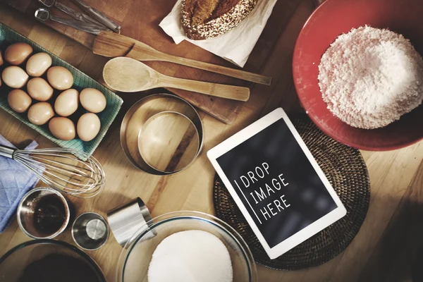 Tablet on kitchen and food