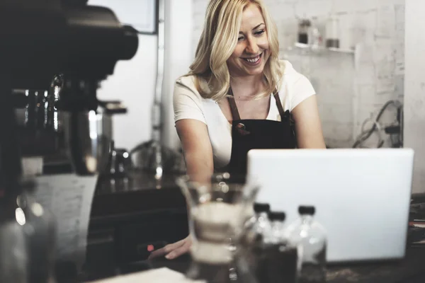 Making Coffee in Barista Cafe