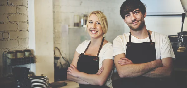 Woman and Man in Barista Cafe