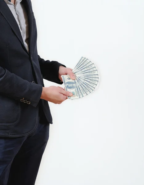 Businessman counts money in studio on a white background