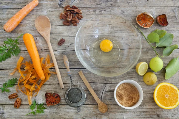 Fruits and vegetables ingredients on wooden table with kitchen utensils and brown sugar