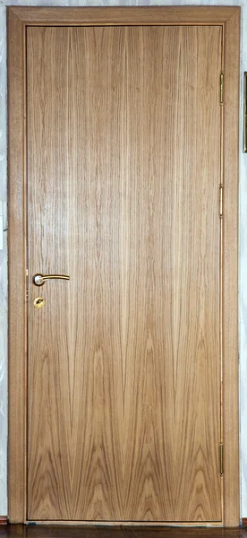 Door, the door covered with oak veneer