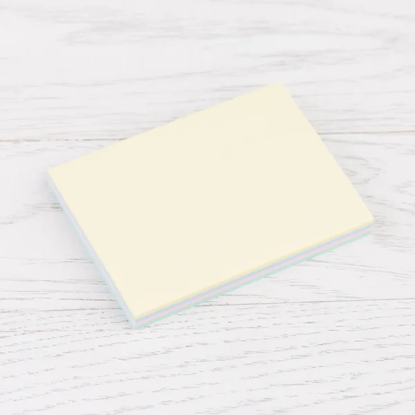 Pack of stickers note on wooden background