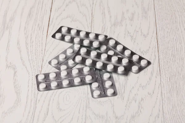 Pills in blister pack on table