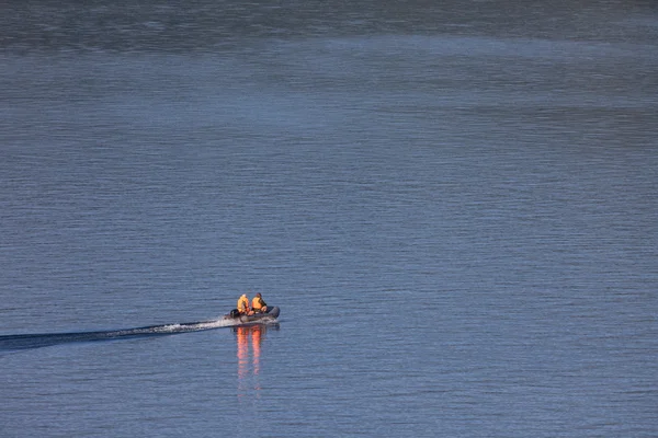 Two fisher in a power boat