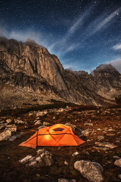 Orange tent in the mountains.