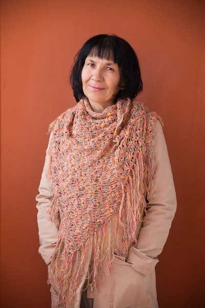Adult woman wearing crocheted shawl