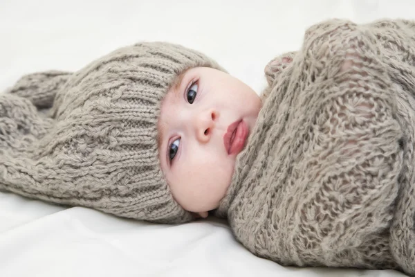 Cute little baby. Newborn baby girl in pink knitted hat. Parenting or love concept.