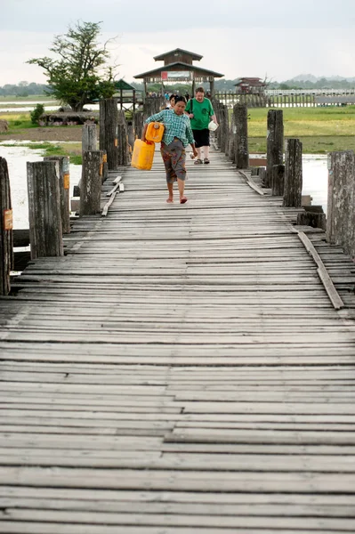 Residents and visitors traveling on the U-Bein Bridge,Myanmar.