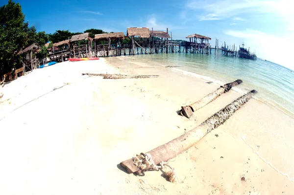 Beach and traditional wooden bridge.