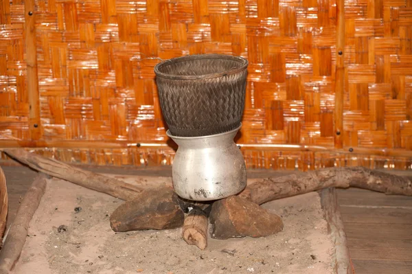 Antique stove to cook rice in Northeast of Thailand .