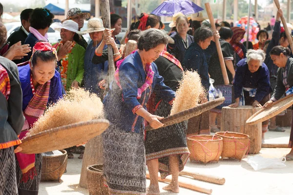 Phutai Minority Woman Winnowing Rice.