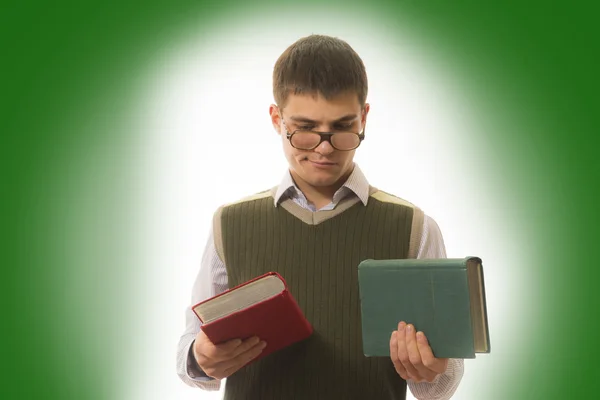 White male student in his hand two books