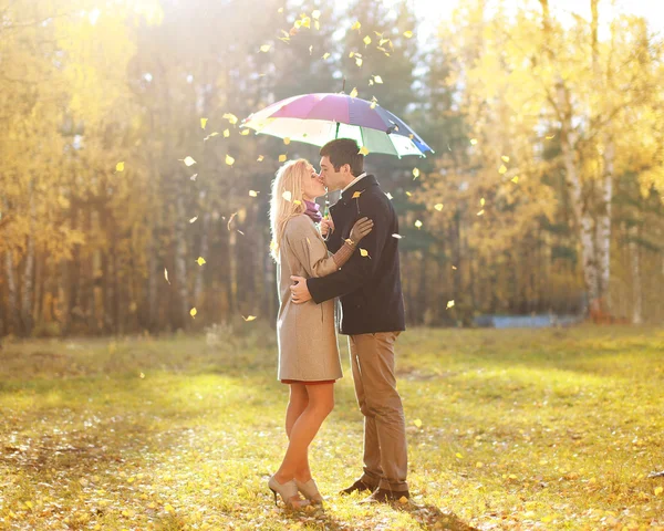 Autumn, love, relationship and people concept - happy kissing co