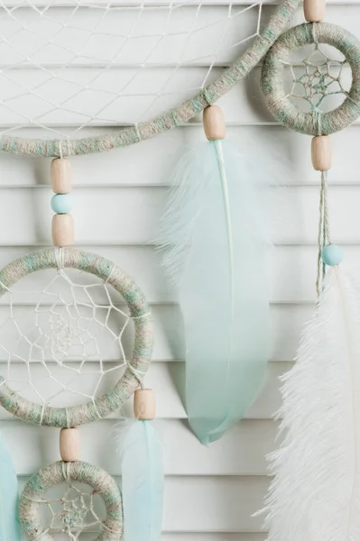 Dream catcher with mint feathers