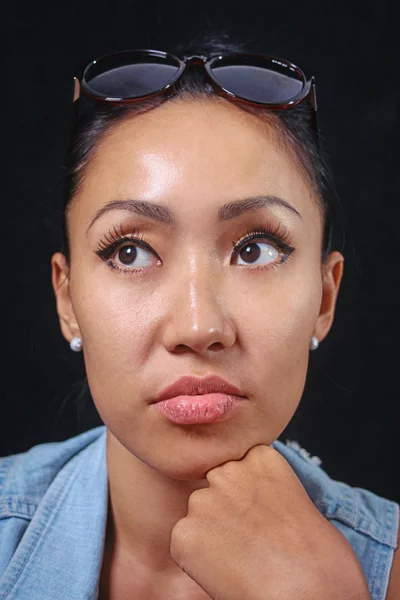 Portrait of a girl looking at the camera with a cute expression on her face