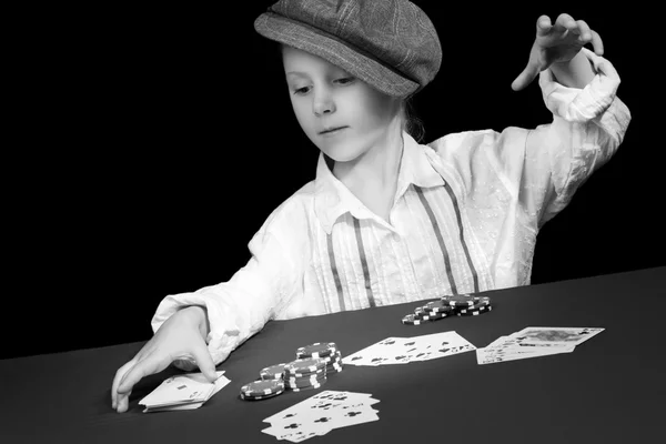 Child is playing cards