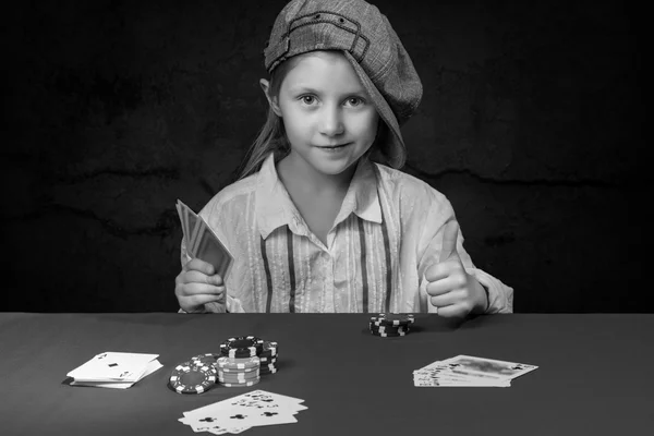 Girl holding a poker card