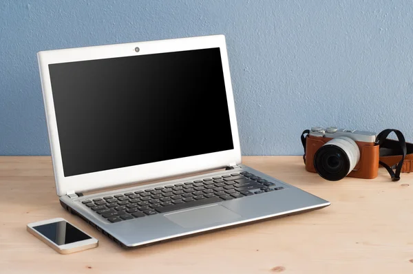 Office Desk with Computer Notebook, Cell Phone and camera