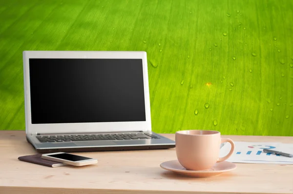 Office table with Coffee cup and Office equipment.