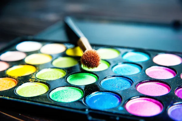Makeup palette with  brush.