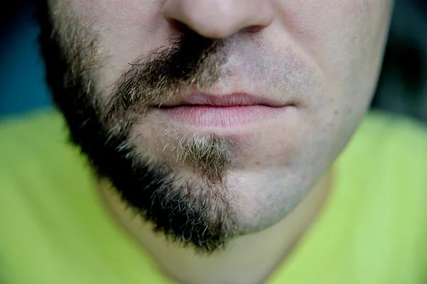 Closeup portraite man with half shaved face beard hair.