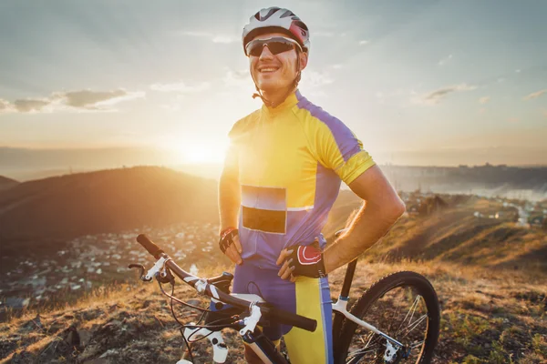 Mountain bike cyclist close up portrait on sunset