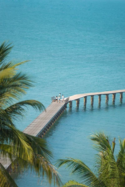 People walking scenic on wooden bridge in beautiful tropical,sea