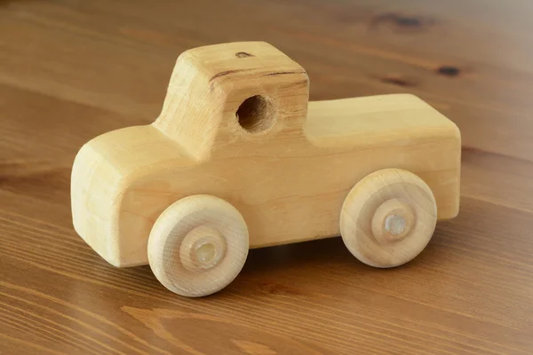 Retro simple plain wooden toy truck on hardwood
