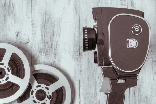 Old movie camera and film reel