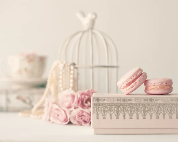 Macaroons and roses with birdcage