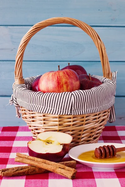 Basket with apples and honey