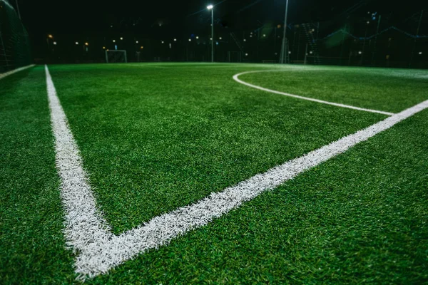 Close up of soccer or football field at night