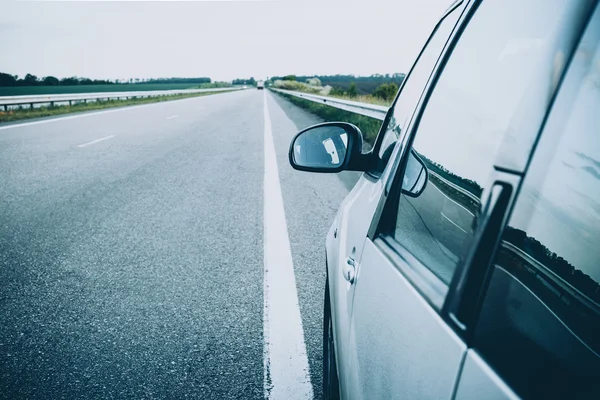 Car on the road with motion blur background