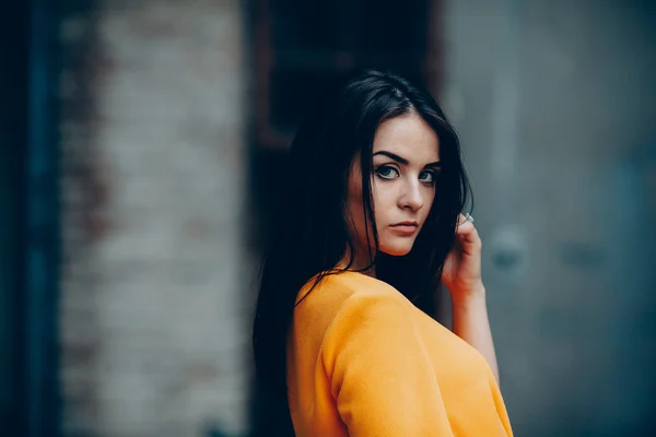 Attractive fashion woman in orange dress