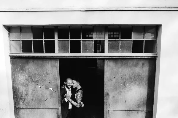 Man and woman hugging in the doorway