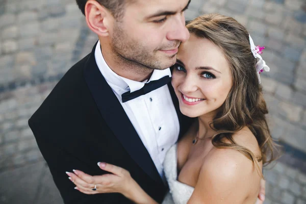 Lovely couple hugging in city.