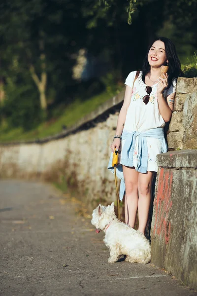 Girl with ice cream and dog
