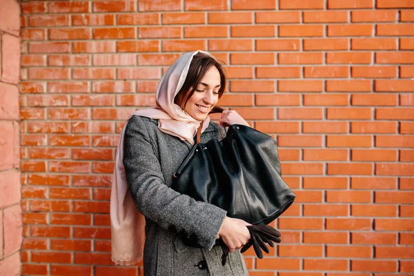 Girl in a coat on the street