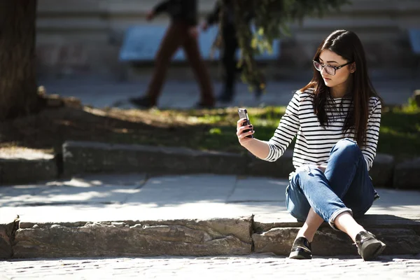 Model in the city with phone