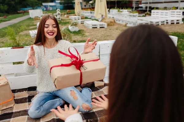 Girls throws gifts to each other