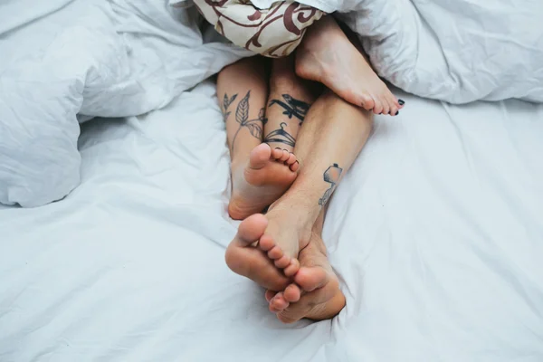 Young couple in bed together