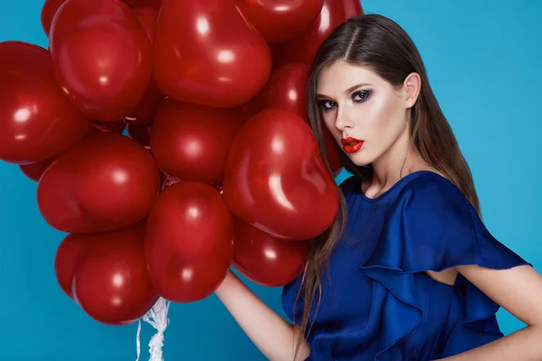 Beautiful sexy brunette woman makeup Valentine's day balloons