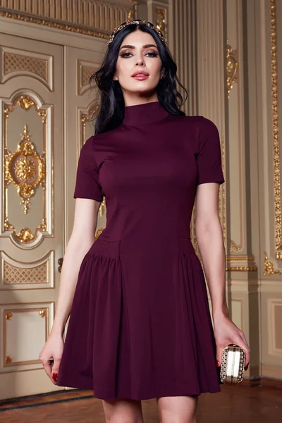 Beautiful sexy woman in elegant dress fashionable autumn Collection of spring long brunette hair makeup tanned slim body figure accessories interior luxury castle gold monogram baroque palace of Queen