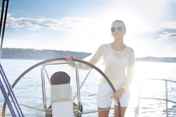 Beautiful sexy young blonde woman, riding a boat on the water, itinerary, beautiful makeup, clothing, summer, sun, perfect body figure shape tan dress swimsuit, sea marine river lake yacht