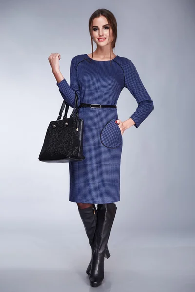 Beautiful sexy woman in blue casual classic dress fashion shoes style accessory handbag catalog clothes collection