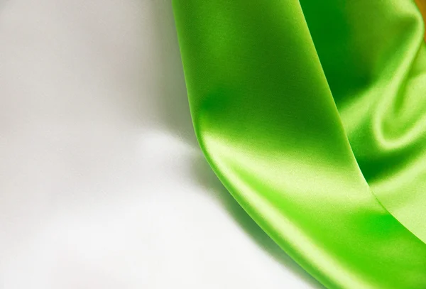 White and green satin fabric