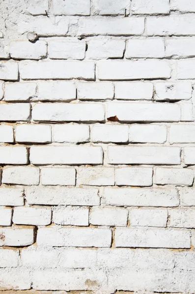 Old grunge brick white wall background