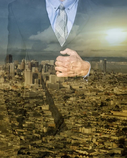 Double exposure of man in suit and cityscape