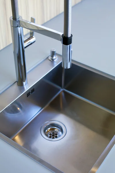 Close up of stainless steel kitchen sink